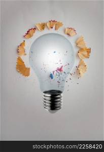 3d render light bulb with pencil saw dust on paper background as creative concept