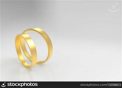 3d rendering. A couple simple Golden rings on gray background.