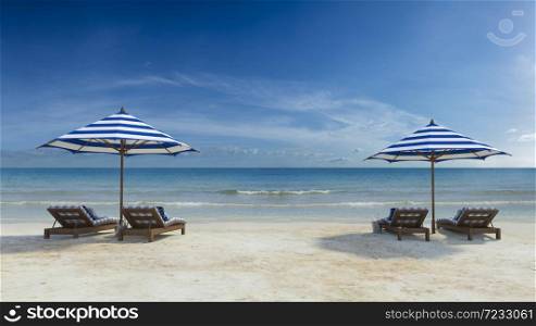 3d rendering image of double wooden day bed under the blue and white umbrella on the beach