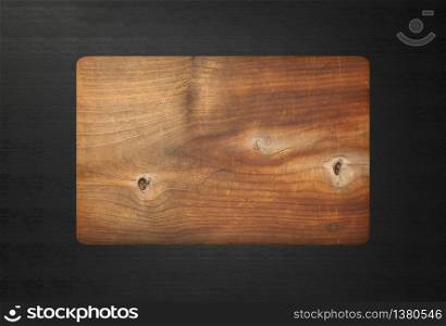 3d rendering. rectangle Chopping Butcher board wooden on black wood table background.