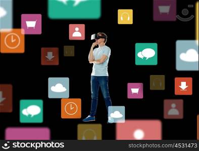 3d technology, augmented reality, gaming, cyberspace and people concept - happy young man in virtual reality headset or 3d glasses thinking with menu icons over black background