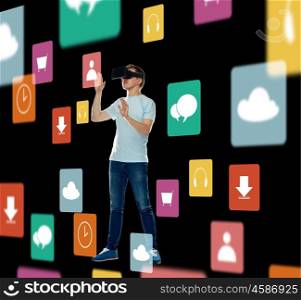 3d technology, augmented reality, gaming, cyberspace and people concept - happy young man in virtual reality headset or 3d glasses with menu icons over black background
