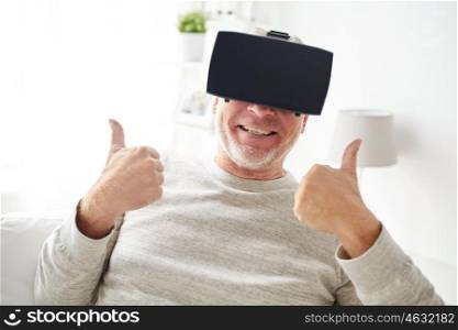 3d technology, augmented reality, gaming, entertainment and people concept - happy senior man with virtual headset or 3d glasses playing videogame at home