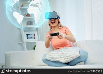 3d technology, augmented reality, gaming, entertainment and people concept - woman in virtual headset or 3d glasses playing video game with controller gamepad at home looking projection of earth globe
