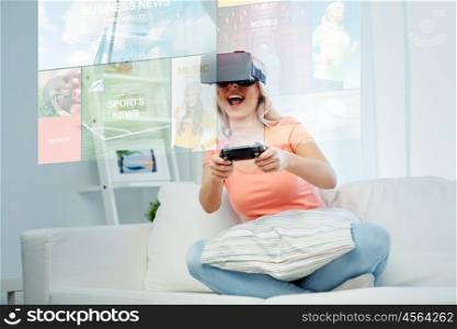 3d technology, augmented reality, gaming, media and people concept - happy young woman in virtual headset or 3d glasses with controller gamepad at home looking at news projection