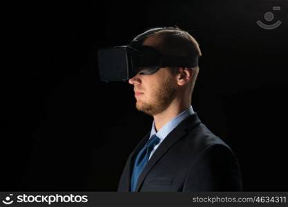 3d technology, virtual reality, cyberspace and augmented reality concept - young businessman with virtual reality headset or 3d glasses over black background