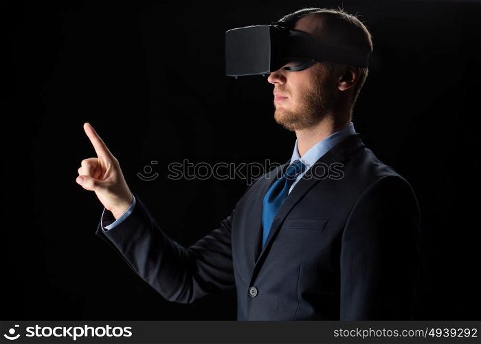 3d technology, virtual reality, cyberspace and augmented reality concept - young businessman with virtual reality headset or 3d glasses over black background. businessman in virtual reality glasses or headset