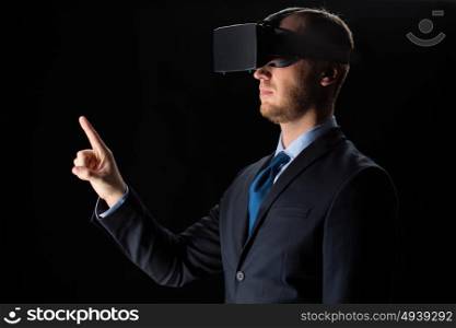 3d technology, virtual reality, cyberspace and augmented reality concept - young businessman with virtual reality headset or 3d glasses over black background. businessman in virtual reality glasses or headset