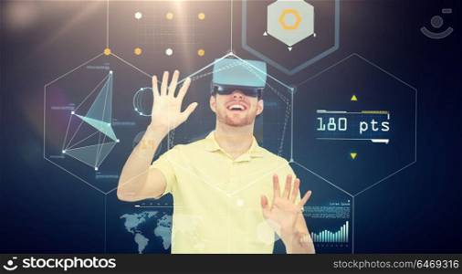 3d technology, virtual reality, cyberspace, entertainment and people concept - happy young man in virtual reality headset or 3d glasses playing game with screens projection over black background. happy man in virtual reality headset or 3d glasses