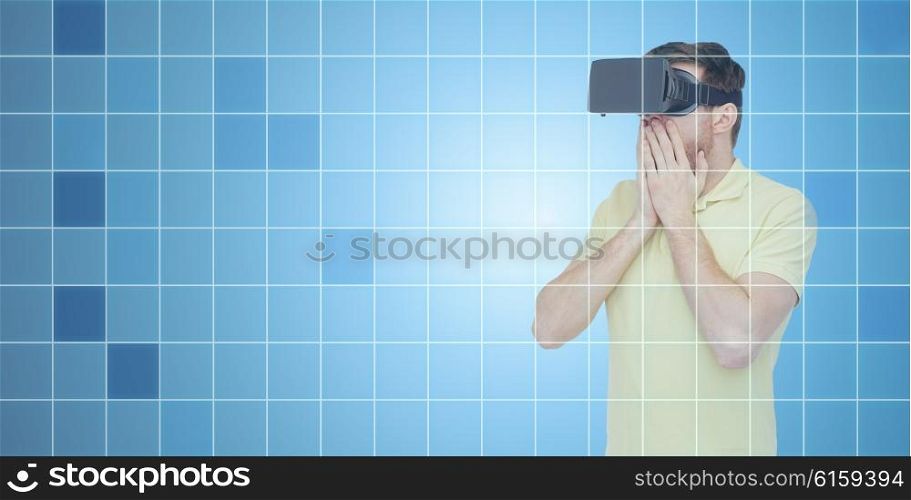 3d technology, virtual reality, entertainment and people concept - amazed young man with virtual reality headset or 3d glasses playing game over blue grid background