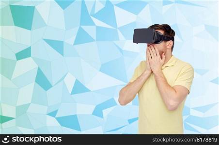 3d technology, virtual reality, entertainment and people concept - amazed young man with virtual reality headset or 3d glasses playing game over low poly background
