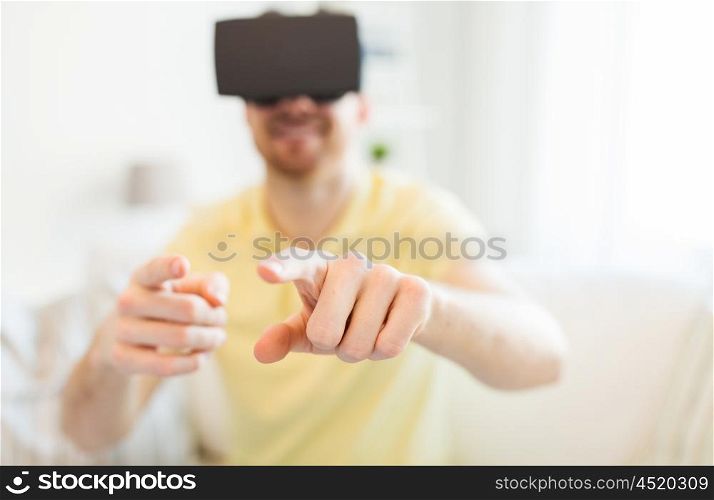 3d technology, virtual reality, entertainment and people concept - close up of happy young man with virtual reality headset or 3d glasses playing game at home