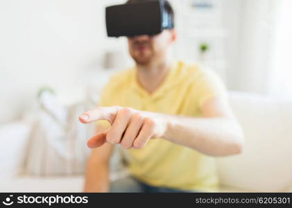 3d technology, virtual reality, entertainment and people concept - close up of happy young man with virtual reality headset or 3d glasses playing game at home