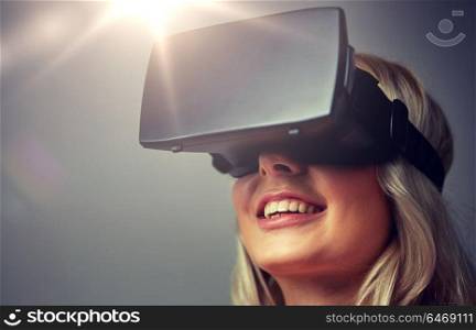 3d technology, virtual reality, entertainment and people concept - close up of young woman with virtual reality headset or 3d glasses. close up of woman in virtual reality headset