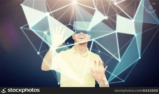 3d technology, virtual reality, entertainment and people concept - happy young in with virtual reality headset or 3d glasses with low poly shape projection over black background. happy man in virtual reality headset or 3d glasses