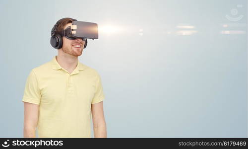 3d technology, virtual reality, entertainment and people concept - happy young man with virtual reality headset or 3d glasses over gray background