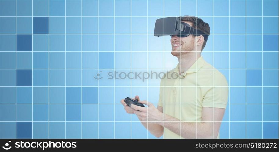 3d technology, virtual reality, entertainment and people concept - happy young man with virtual reality headset or 3d glasses playing with game controller gamepad over blue grid background
