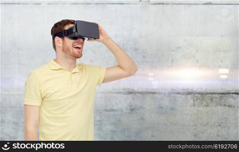 3d technology, virtual reality, entertainment and people concept - happy young man with virtual reality headset or 3d glasses over gray concrete wall background