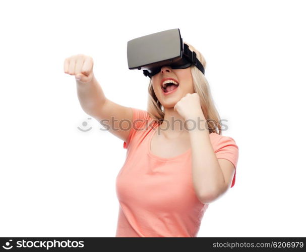 3d technology, virtual reality, entertainment and people concept - happy young woman with virtual reality headset or 3d glasses playing game and fighting