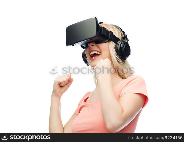 3d technology, virtual reality, entertainment and people concept - happy young woman with virtual reality headset or 3d glasses playing game and fighting