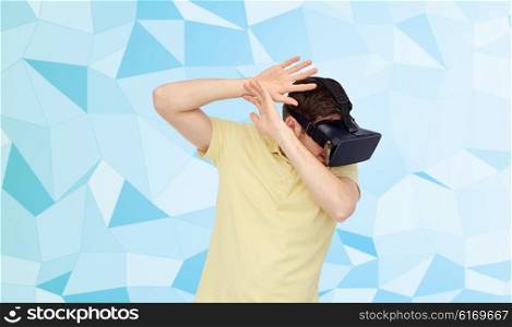 3d technology, virtual reality, entertainment and people concept - scared young man with virtual reality headset or 3d glasses playing game and covering from something over low poly background