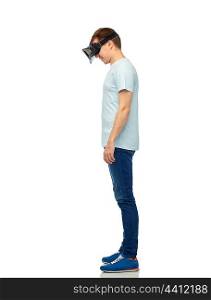 3d technology, virtual reality, entertainment, cyberspace and people concept - happy young man with virtual reality headset or 3d glasses looking down