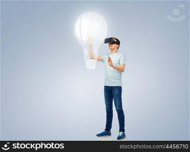 3d technology, virtual reality, entertainment, cyberspace and people concept - happy young man with virtual reality headset or 3d glasses playing game and touching light bulb projection