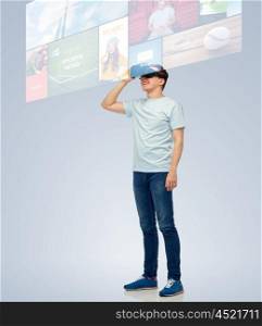 3d technology, virtual reality, entertainment, cyberspace and people concept - happy young man with virtual reality headset or 3d glasses looking at screen with internet news