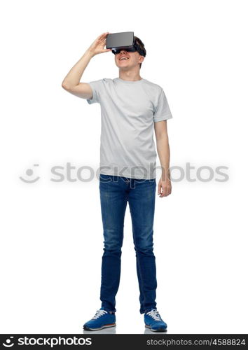 3d technology, virtual reality, entertainment, cyberspace and people concept - happy young man with virtual reality headset or 3d glasses