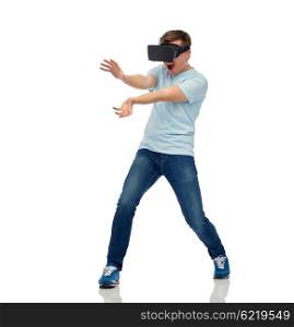 3d technology, virtual reality, entertainment, cyberspace and people concept - happy young man with virtual reality headset or 3d glasses playing game and catching something
