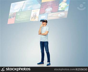 3d technology, virtual reality, entertainment, cyberspace and people concept - happy young man with virtual reality headset or 3d glasses thinking and looking at screen with internet news