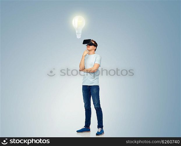 3d technology, virtual reality, entertainment, cyberspace and people concept - happy young man with virtual reality headset or 3d glasses thinking and looking at light bulb projection