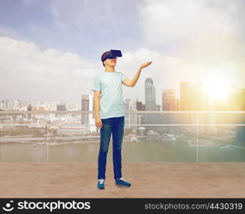 3d technology, virtual reality, entertainment, cyberspace and people concept - man with virtual reality headset or 3d glasses playing game holding something on palm over singapore background