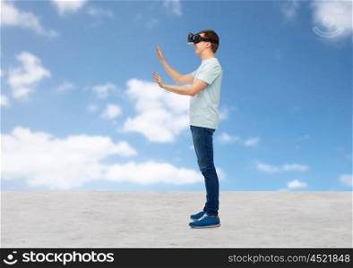 3d technology, virtual reality, entertainment, cyberspace and people concept - man with virtual reality headset or 3d glasses playing game and touching something over blue sky and clouds background