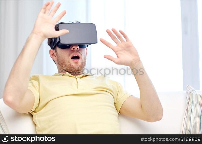 3d technology, virtual reality, gaming, entertainment and people concept - amazed or scared young man with virtual reality headset or 3d glasses playing game