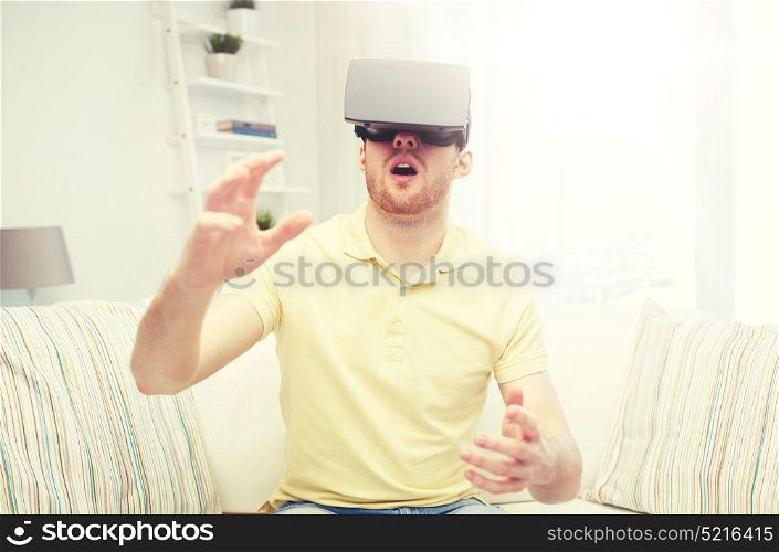 3d technology, virtual reality, gaming, entertainment and people concept - amazed young man with virtual reality headset or 3d glasses playing game. young man in virtual reality headset or 3d glasses