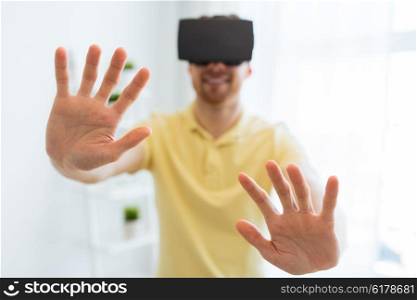3d technology, virtual reality, gaming, entertainment and people concept - close up of happy young man with virtual reality headset or 3d glasses playing videogame at home
