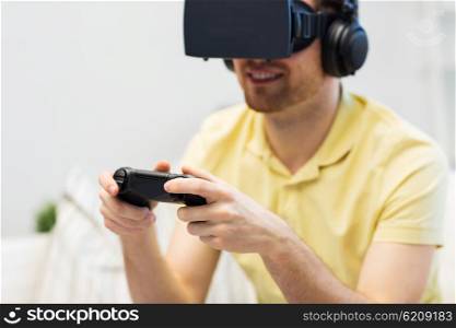 3d technology, virtual reality, gaming, entertainment and people concept - close up of man with virtual reality headset or 3d glasses and headphones playing video game with controller gamepad at home