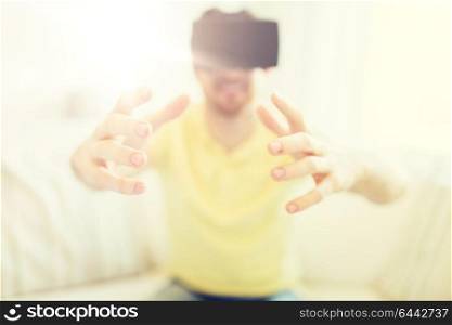 3d technology, virtual reality, gaming, entertainment and people concept - close up of young man with virtual reality headset or 3d glasses playing videogame at home. young man in virtual reality headset or 3d glasses