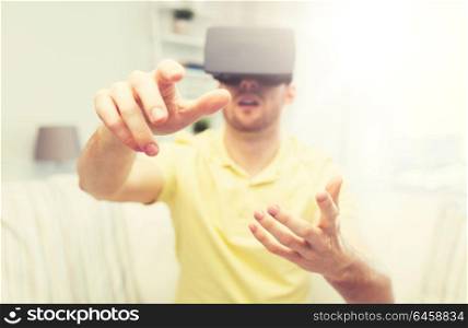 3d technology, virtual reality, gaming, entertainment and people concept - close up of young man with virtual reality headset or 3d glasses playing videogame at home. young man in virtual reality headset or 3d glasses