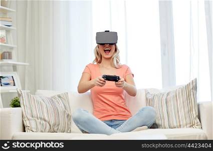 3d technology, virtual reality, gaming, entertainment and people concept - happy young woman with virtual reality headset or 3d glasses playing video game with controller gamepad at home