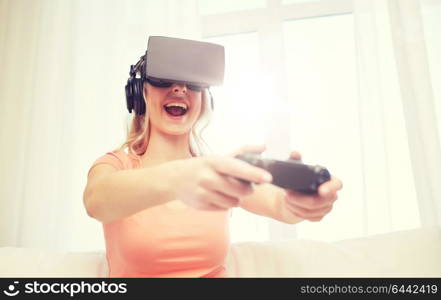 3d technology, virtual reality, gaming, entertainment and people concept - happy young woman in virtual reality headset or 3d glasses and headphones playing video game with controller gamepad at home. woman in virtual reality headset with controller
