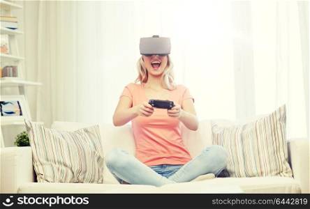 3d technology, virtual reality, gaming, entertainment and people concept - happy young woman with virtual reality headset or 3d glasses playing video game with controller gamepad at home. woman in virtual reality headset with controller