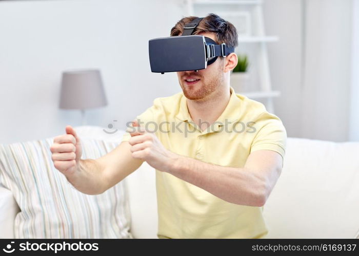 3d technology, virtual reality, gaming, entertainment and people concept - young man with virtual reality headset or 3d glasses playing racing videogame at home