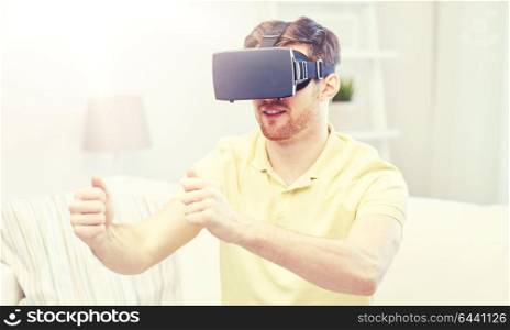 3d technology, virtual reality, gaming, entertainment and people concept - young man with virtual reality headset or 3d glasses playing racing videogame at home. young man in virtual reality headset at home