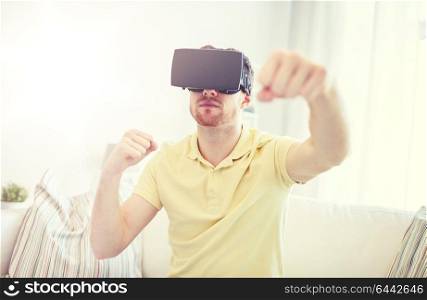 3d technology, virtual reality, gaming, entertainment and people concept - young man with virtual reality headset or 3d glasses playing combat game and fighting. young man in virtual reality headset or 3d glasses