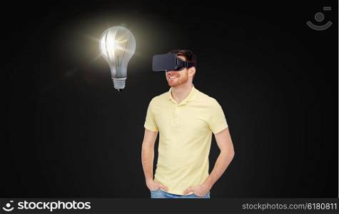 3d technology, virtual reality, idea, entertainment and people concept - happy young man in virtual reality headset or 3d glasses looking at light bulb over black background