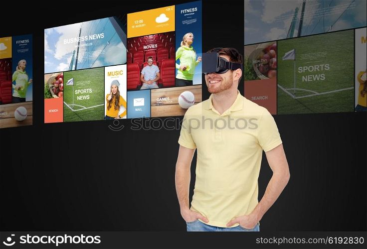 3d technology, virtual reality, mass media, entertainment and people concept - happy young man in virtual reality headset or 3d glasses with screens projection over black background