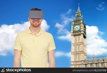 3d technology, virtual reality, travel, entertainment and people concept - happy young man with virtual reality headset or 3d glasses over london big ben tower and sky background