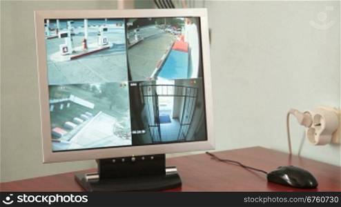 4-channel video security monitor in the in the office of retail gas station, timelapse